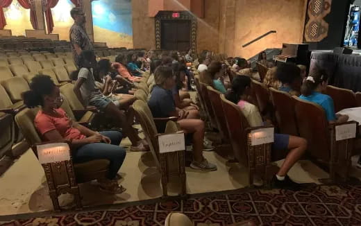 a group of people sitting in a room