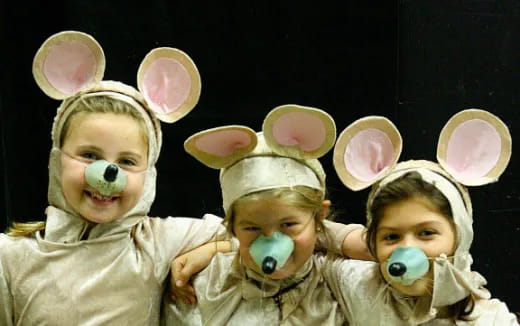 a group of children wearing bunny ears and masks