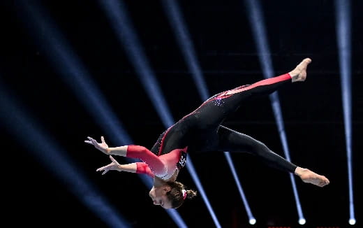 a person performing a gymnastics trick