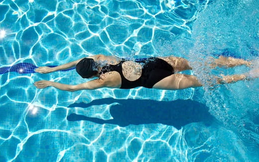 a person swimming in a pool