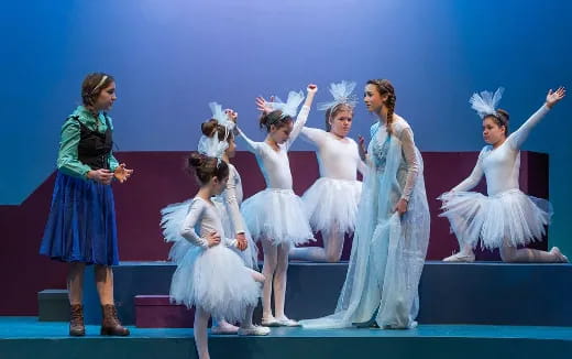 a group of women dancing on a stage