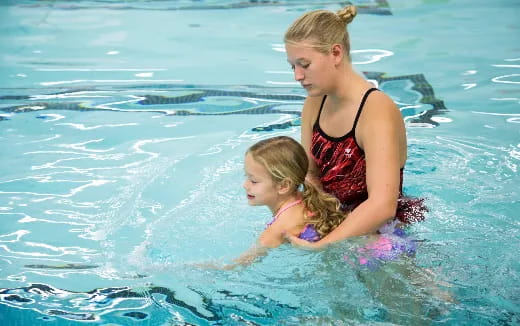 a woman and a child in the water