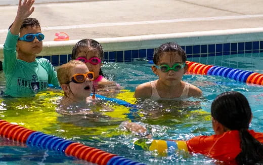 a group of people in a pool