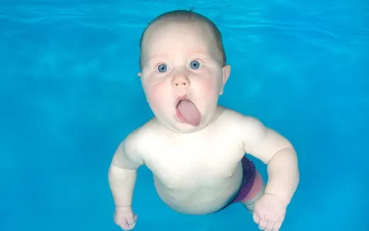 a baby in a pool