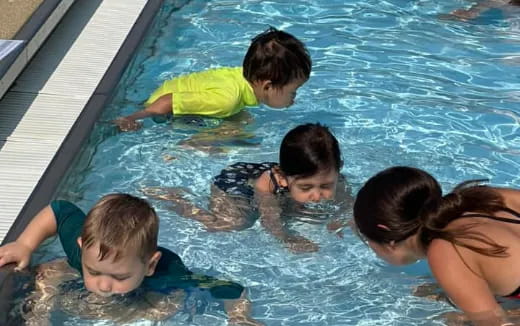 a group of people in a pool