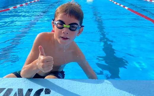 a boy in a pool