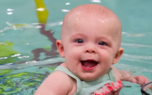 a baby in a pool