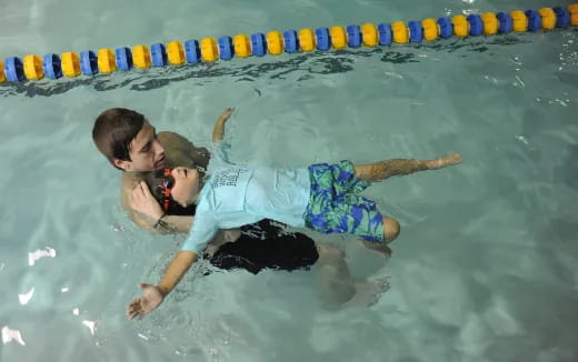 a man and a woman in a pool