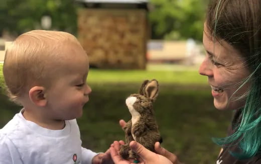 a person holding a baby