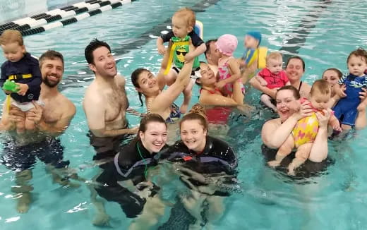 a group of people in a pool