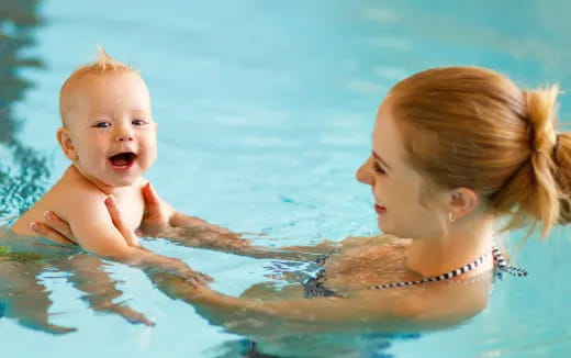a person and a baby in the water
