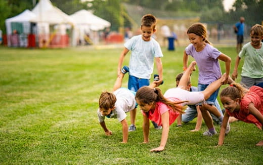 a group of people playing with a toy