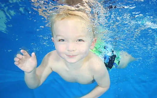 a boy in a pool