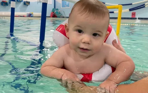 a baby in a pool