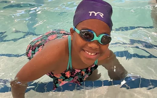 a person in a swimsuit in a pool