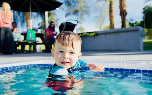 a boy in a pool