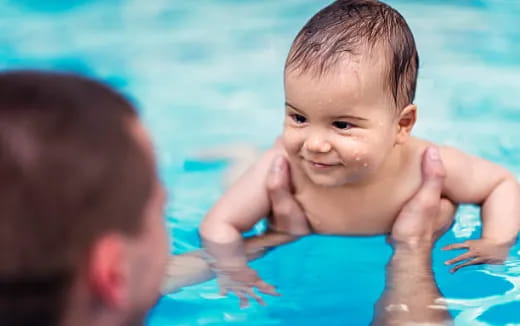 a baby in a pool