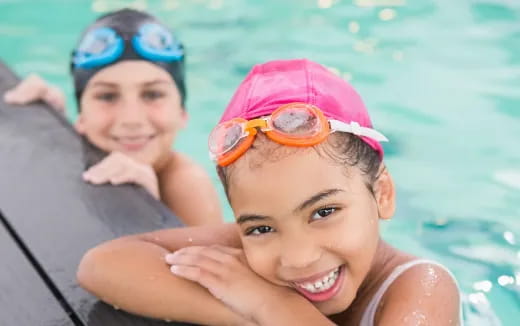 a couple of girls in a pool