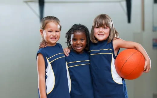 a group of girls in basketball uniforms
