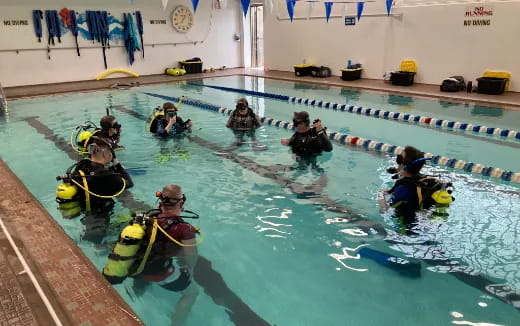 a group of people in a pool