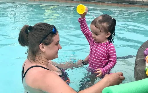 a person and a child in a pool