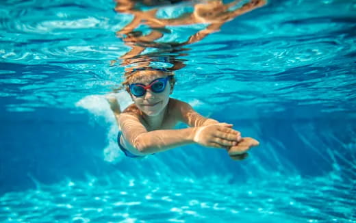 a person swimming in a pool