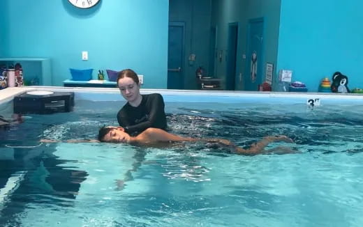 a woman and a man in a swimming pool