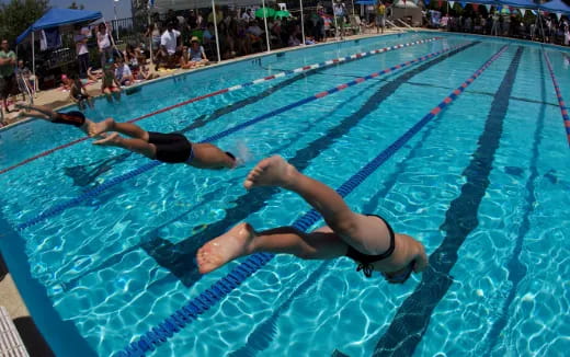 a group of people in a swimming pool