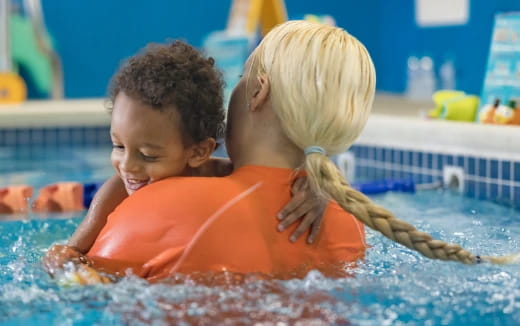 a couple of children in a pool