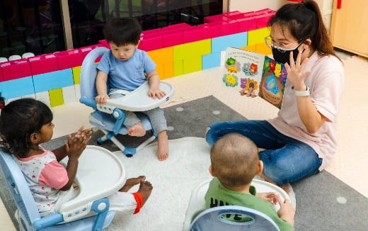 a person and children playing with toys