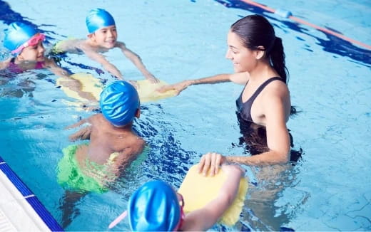 a group of people in a pool