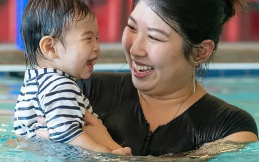 a woman holding a baby