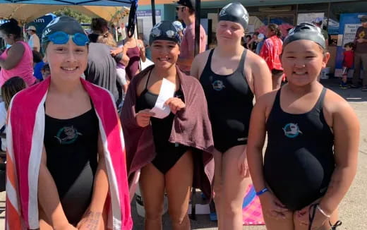 a group of women in swimsuits