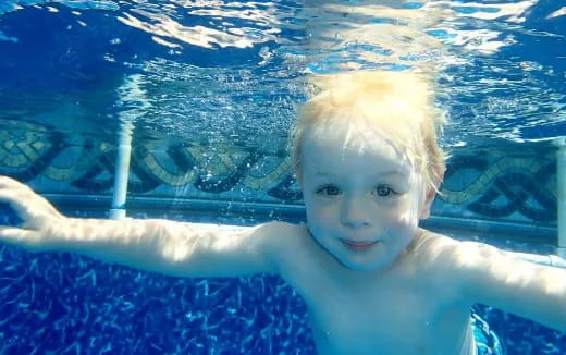 a person swimming in a pool