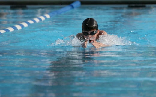 a person swimming in a pool