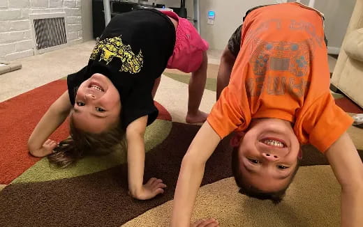 a couple of children lying on the floor