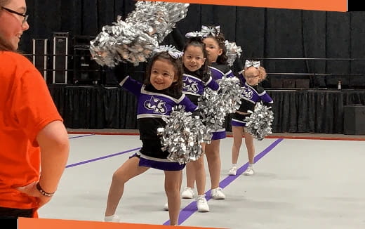 a group of cheerleaders on a court