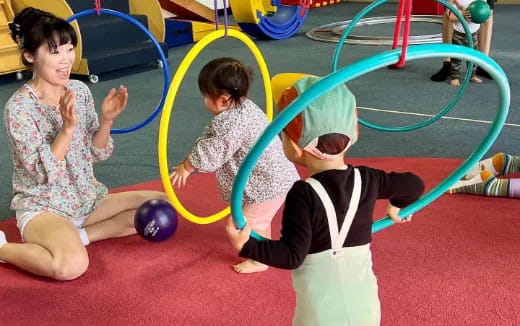 a group of children playing in a gym