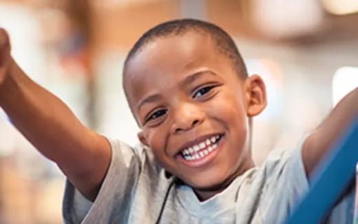 a close-up of a boy smiling