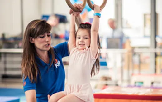 a person and a girl doing a handstand