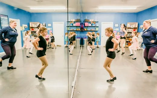 a group of people exercising in a room