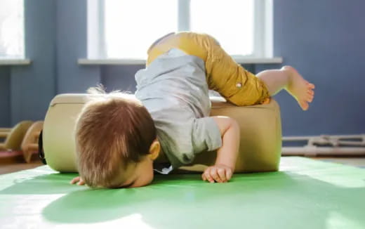 a baby crawling on the floor