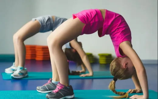 a person doing a plank on a mat