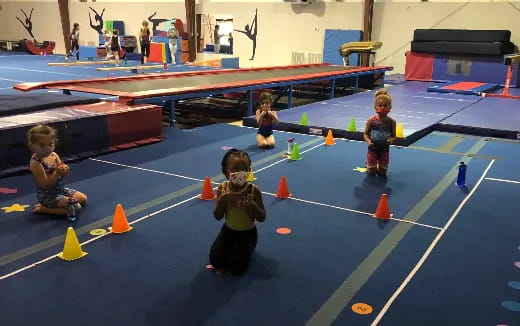 a group of kids playing in a gymnasium