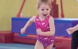 a girl running on a track