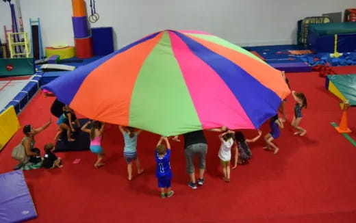 children playing on a red carpet