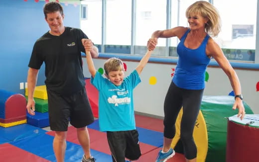 a woman and two children exercising