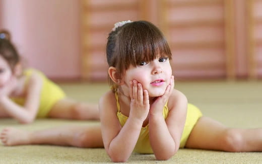 a young girl with her hands on her face