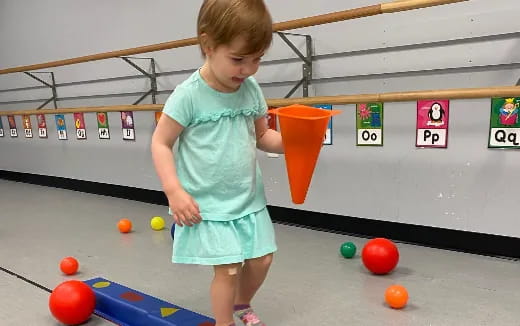 a child playing with balls