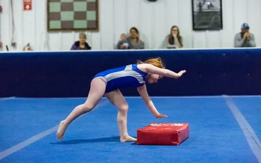 a woman doing a cartwheel